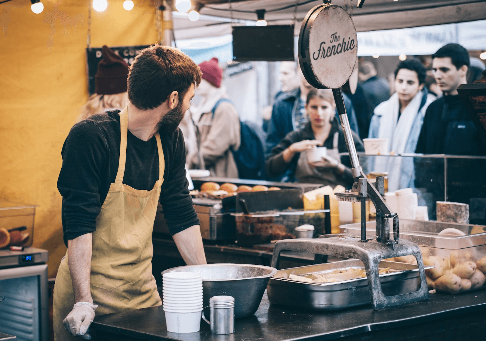 Image of a restaurant worker receiving feedback from customers