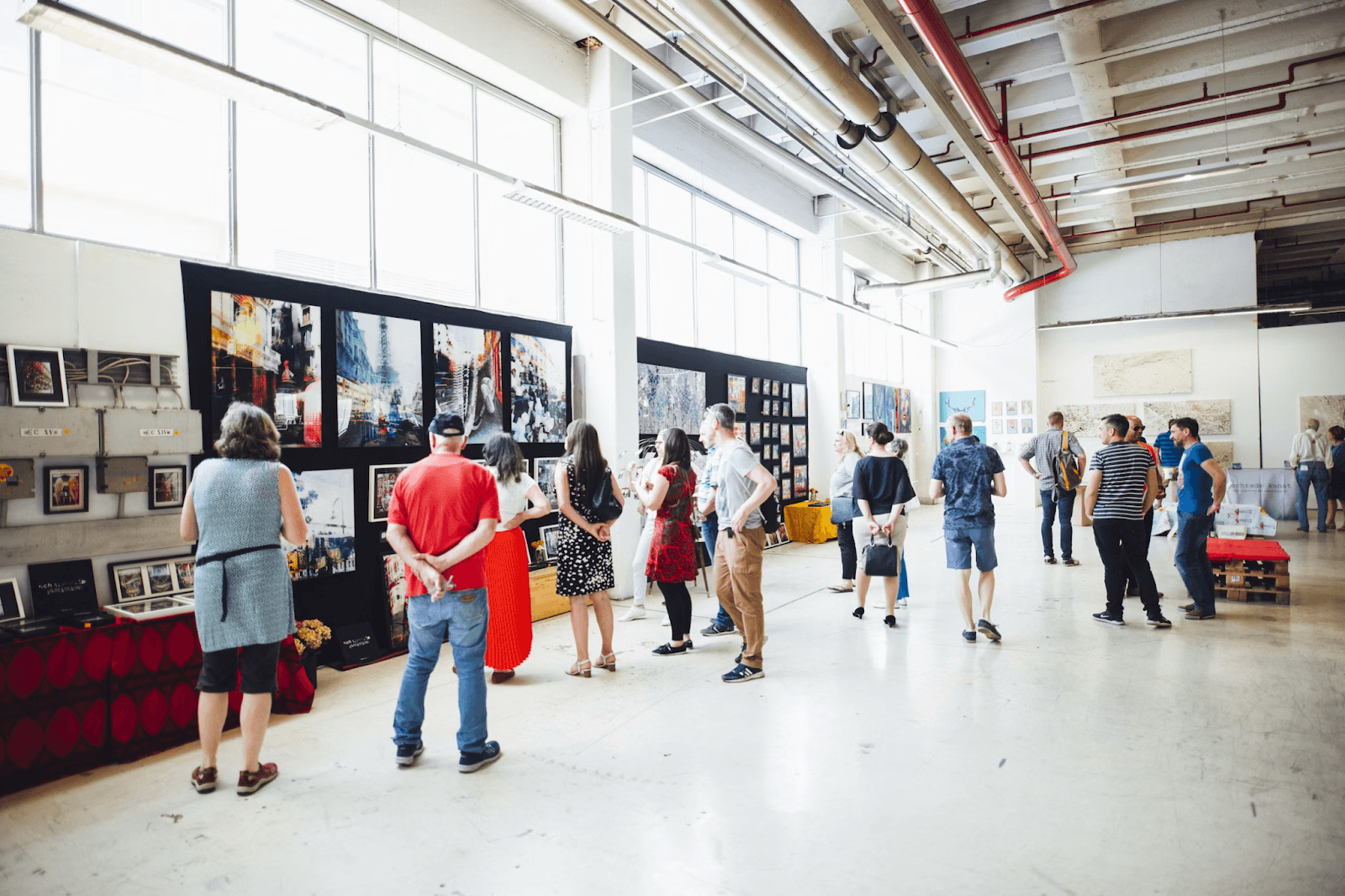Image of an art show with many attendees